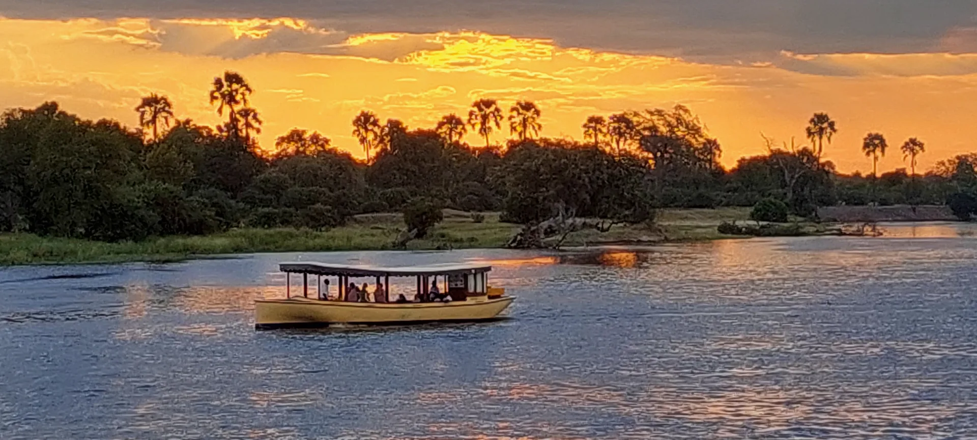Safari boat on the Zambezi at sunset